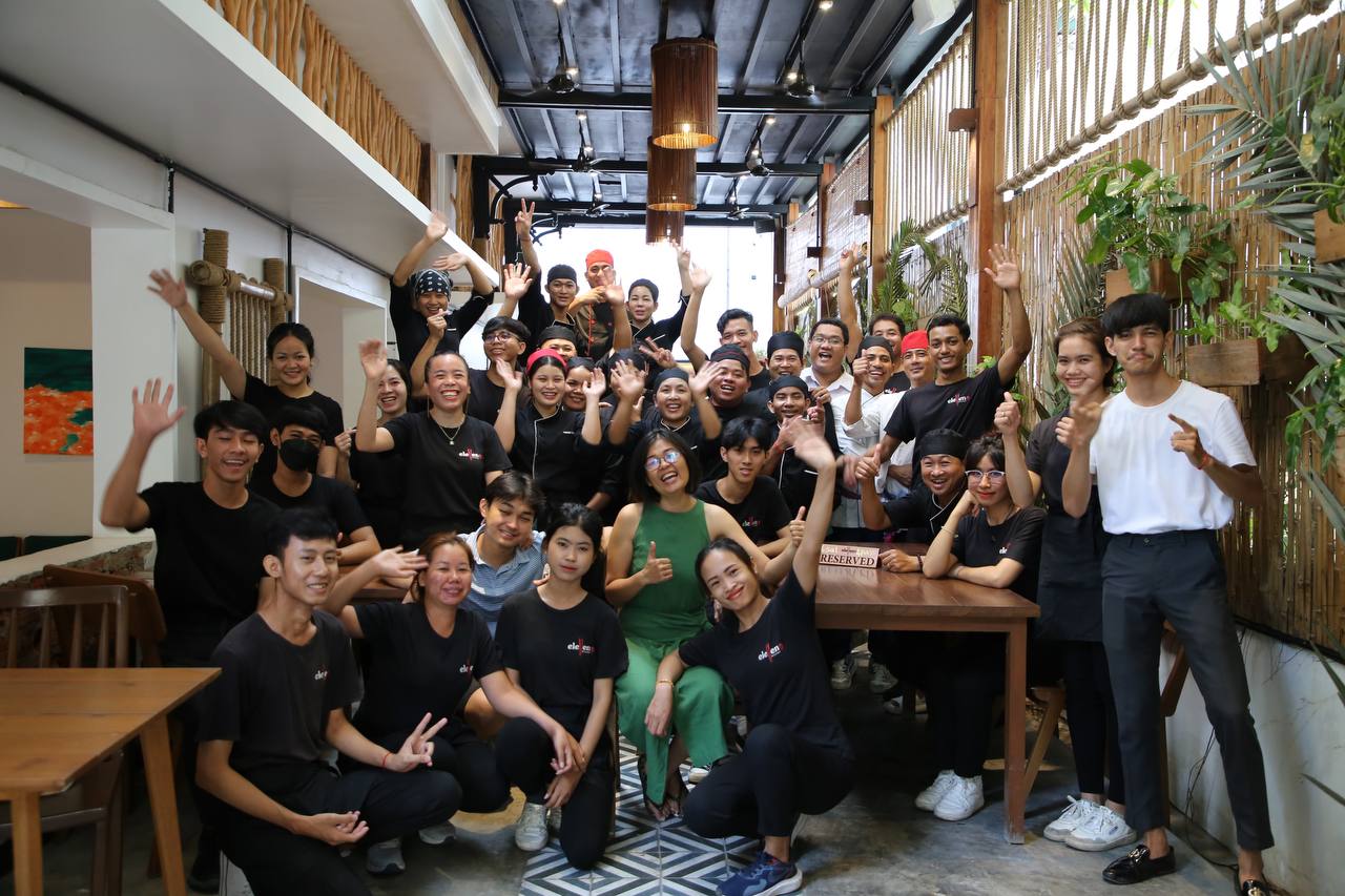Eleven One Kitchen team members — trained, warm, and proud of their craft